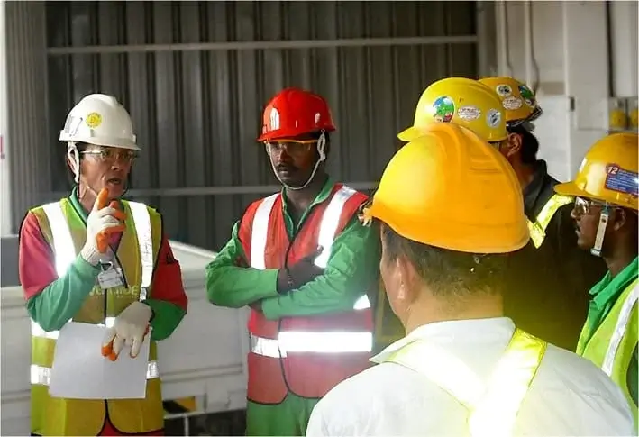 Crane operators are listening to an instructor speaking
