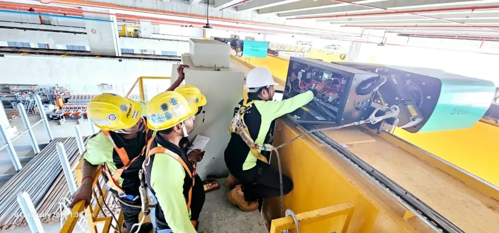 A group of certified inspectors is checking a crane