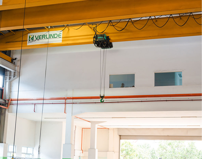 Jenmon crane and excavator working inside a warehouse